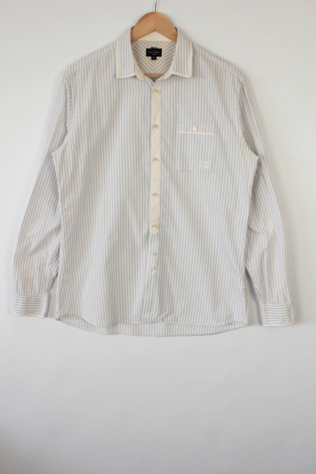 Paul Smith blue and white striped popover shirt with fine vertical pinstripes.