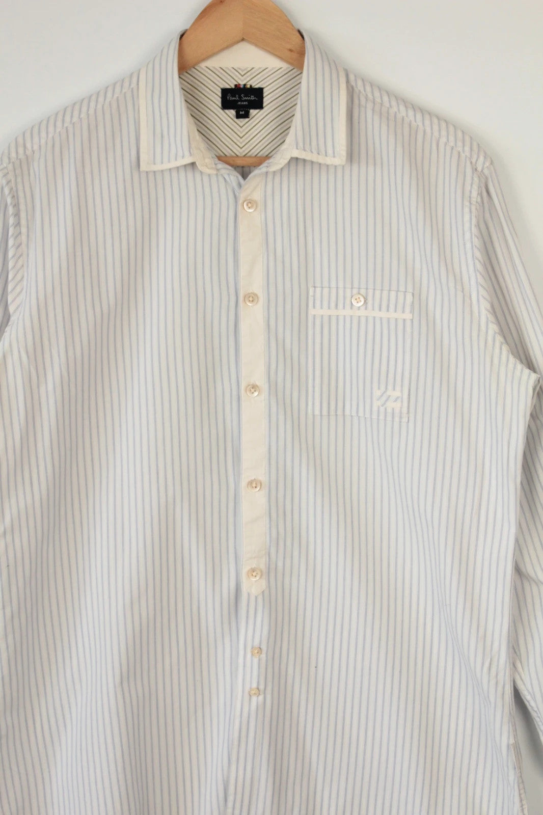 Paul Smith blue and white striped popover shirt with fine vertical pinstripes.