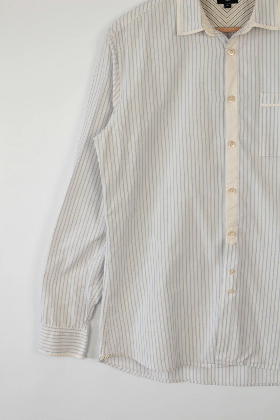 Paul Smith blue and white striped popover shirt with fine vertical pinstripes.