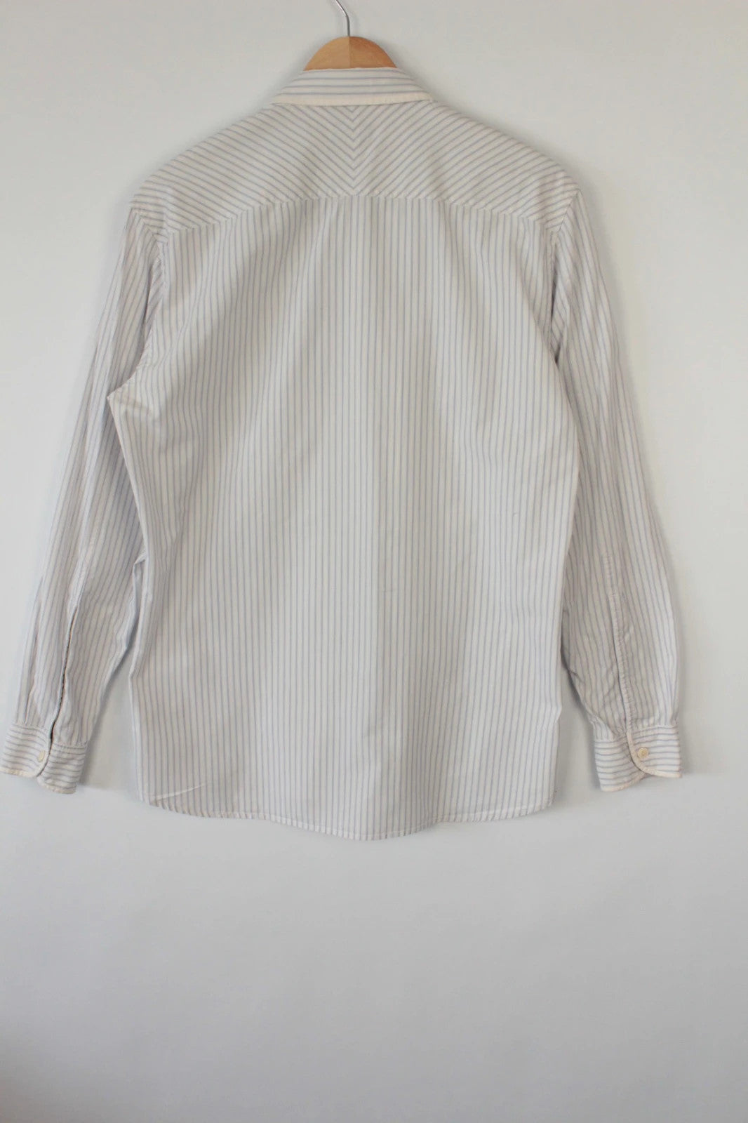 Paul Smith blue and white striped popover shirt with fine vertical pinstripes.