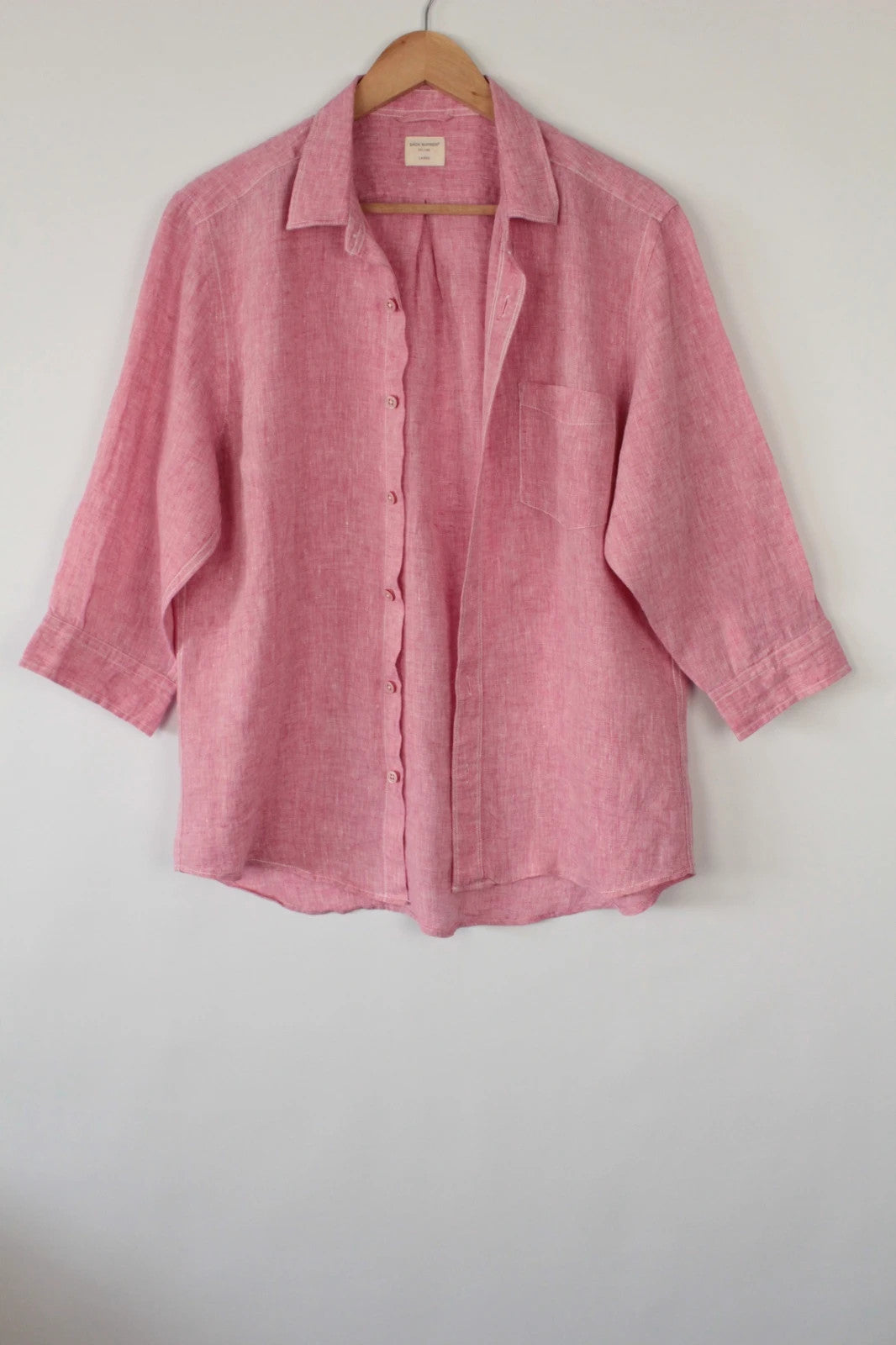 Back Number coral pink linen button-down blouse with three-quarter sleeves and relaxed fit.