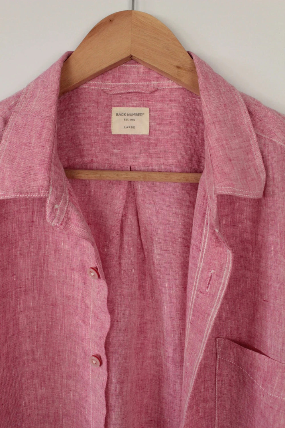 Back Number coral pink linen button-down blouse with three-quarter sleeves and relaxed fit.