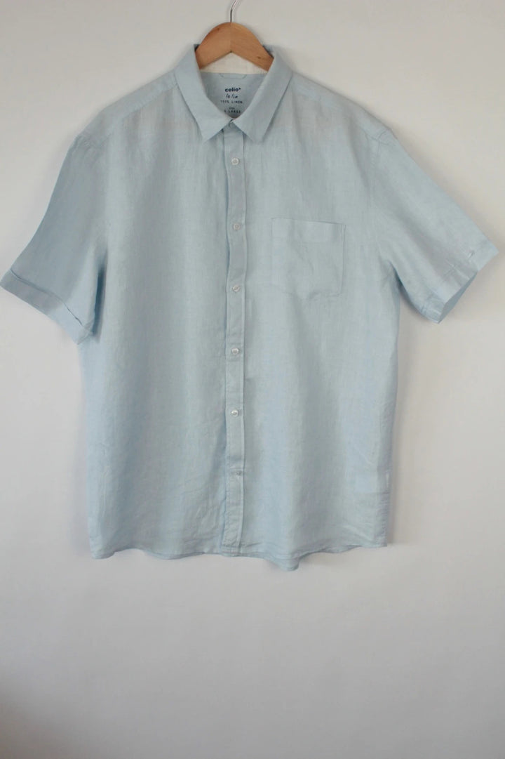 Celio short sleeve shirt baby blue 100% linen with button-down front and relaxed fit.