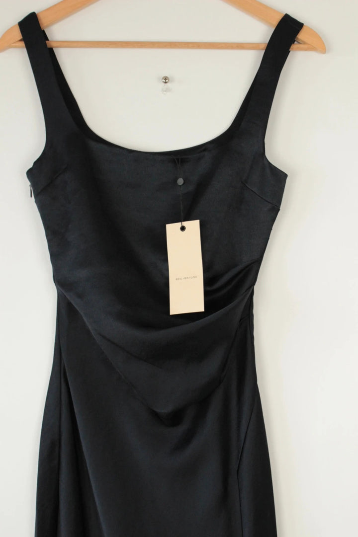 Bec & Bridge deep navy satin maxi dress with square neck and cowl waist detail.