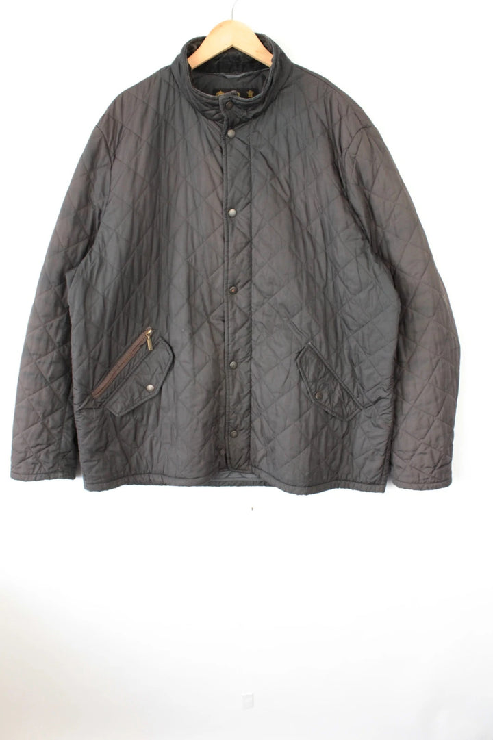 Barbour brown quilted Chelsea jacket with diamond pattern and snap-button storm flap closure.