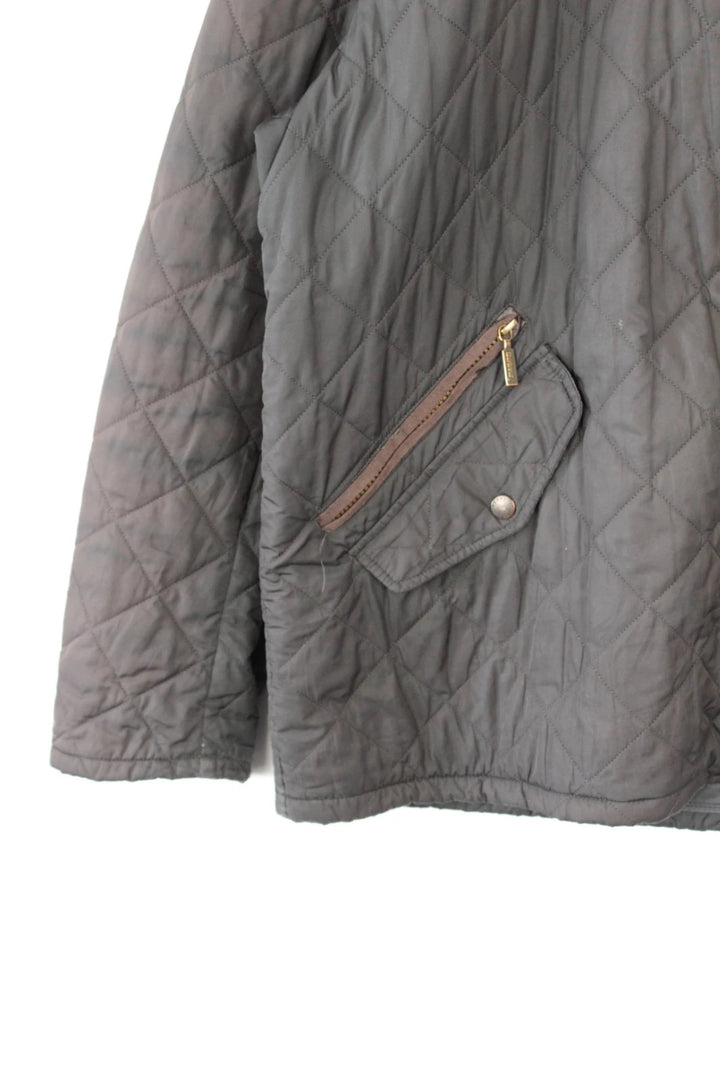 Barbour brown quilted Chelsea jacket with diamond pattern and snap-button storm flap closure.