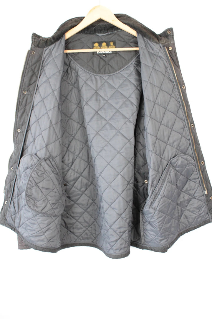 Barbour brown quilted Chelsea jacket with diamond pattern and snap-button storm flap closure.