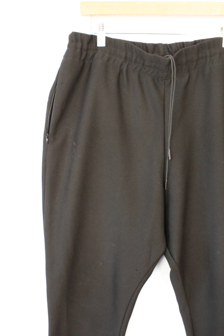 AQ/AQ black joggers with drop-crotch design and elasticated drawstring waist.