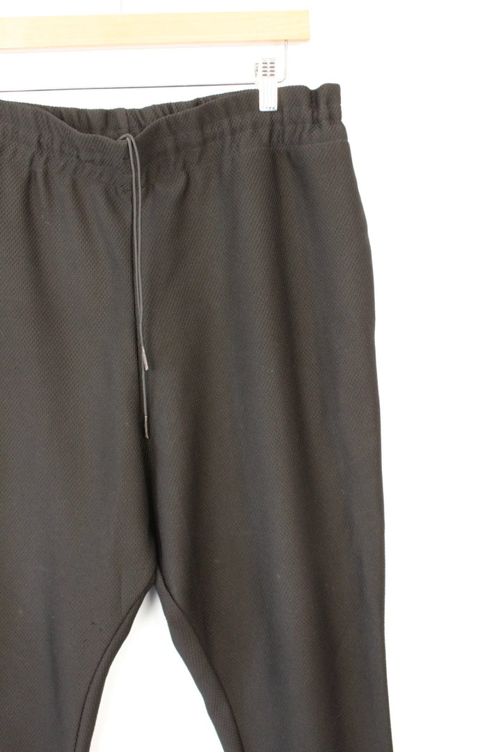 AQ/AQ black joggers with drop-crotch design and elasticated drawstring waist.
