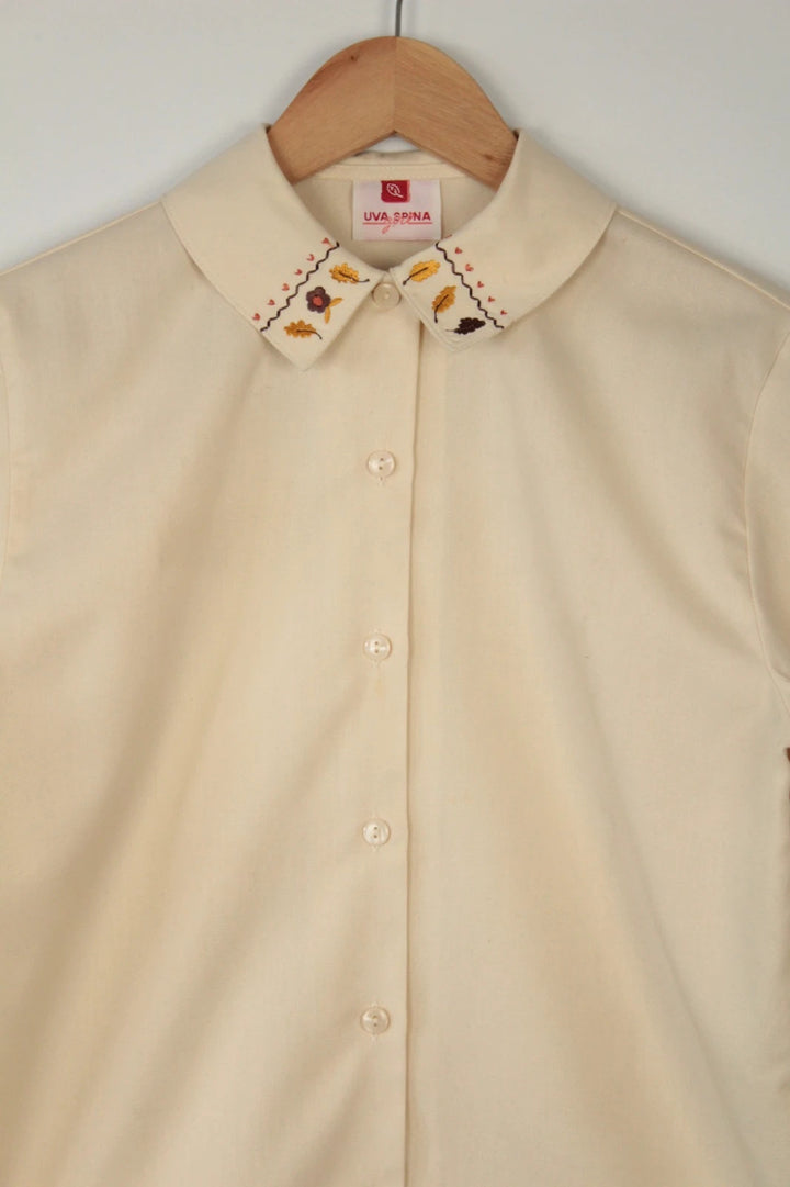 Vintage Dressing cream tunic blouse with embroidered Peter Pan collar and balloon sleeves.
