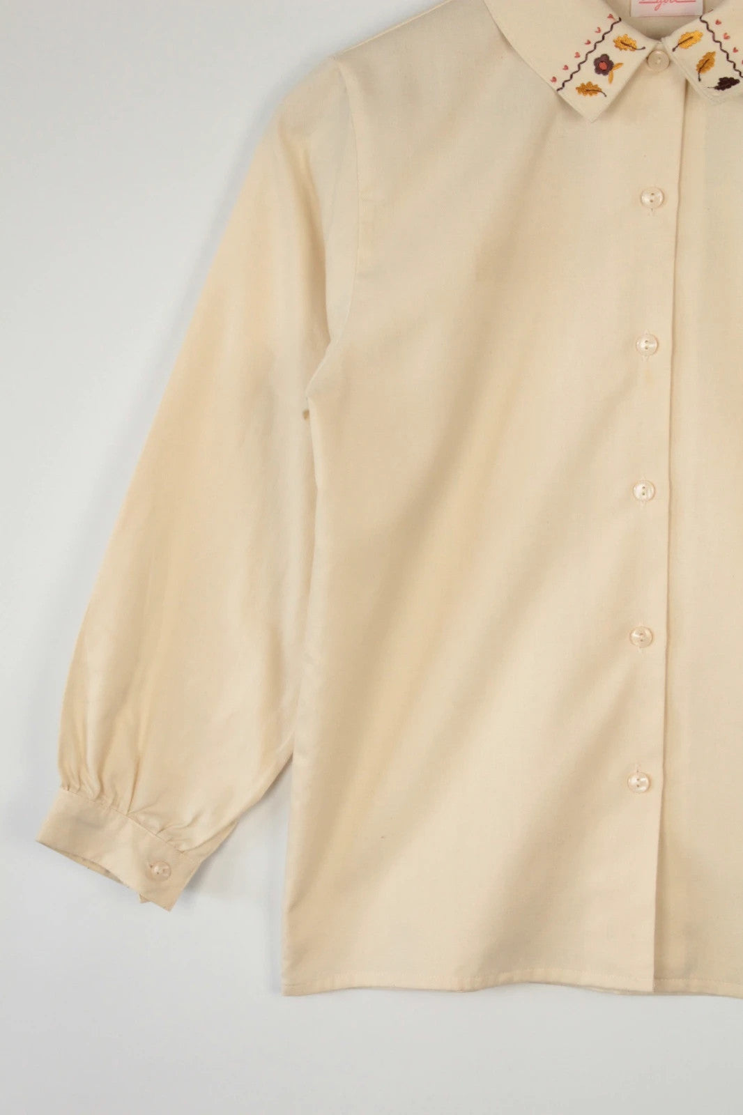 Vintage Dressing cream tunic blouse with embroidered Peter Pan collar and balloon sleeves.