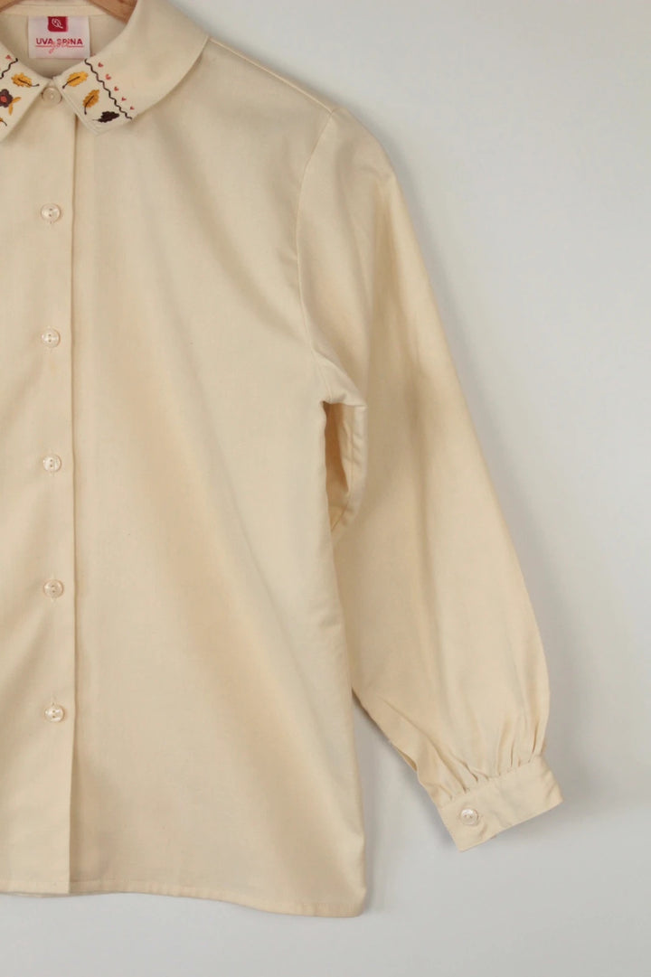 Vintage Dressing cream tunic blouse with embroidered Peter Pan collar and balloon sleeves.