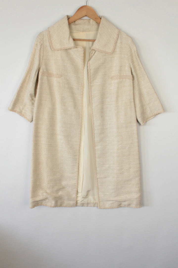 Vintage Dressing beige duster coat open front bouclé tweed textured fabric elegant drape.