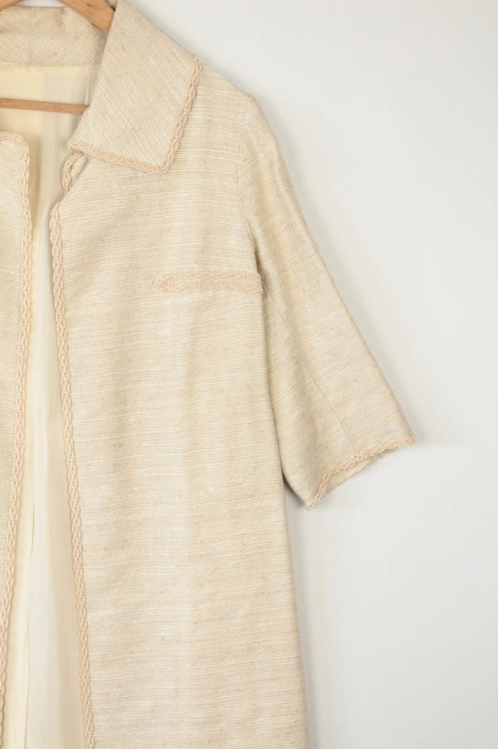 Vintage Dressing beige duster coat open front bouclé tweed textured fabric elegant drape.