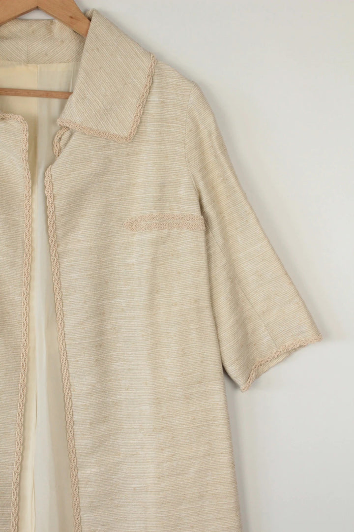 Vintage Dressing beige duster coat open front bouclé tweed textured fabric elegant drape.