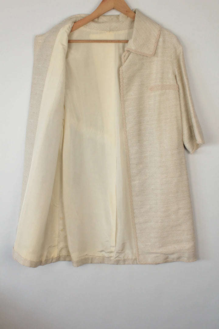 Vintage Dressing beige duster coat open front bouclé tweed textured fabric elegant drape.