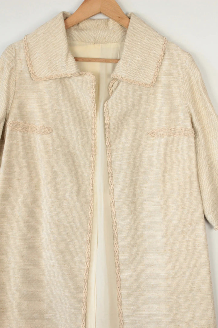 Vintage Dressing beige duster coat open front bouclé tweed textured fabric elegant drape.