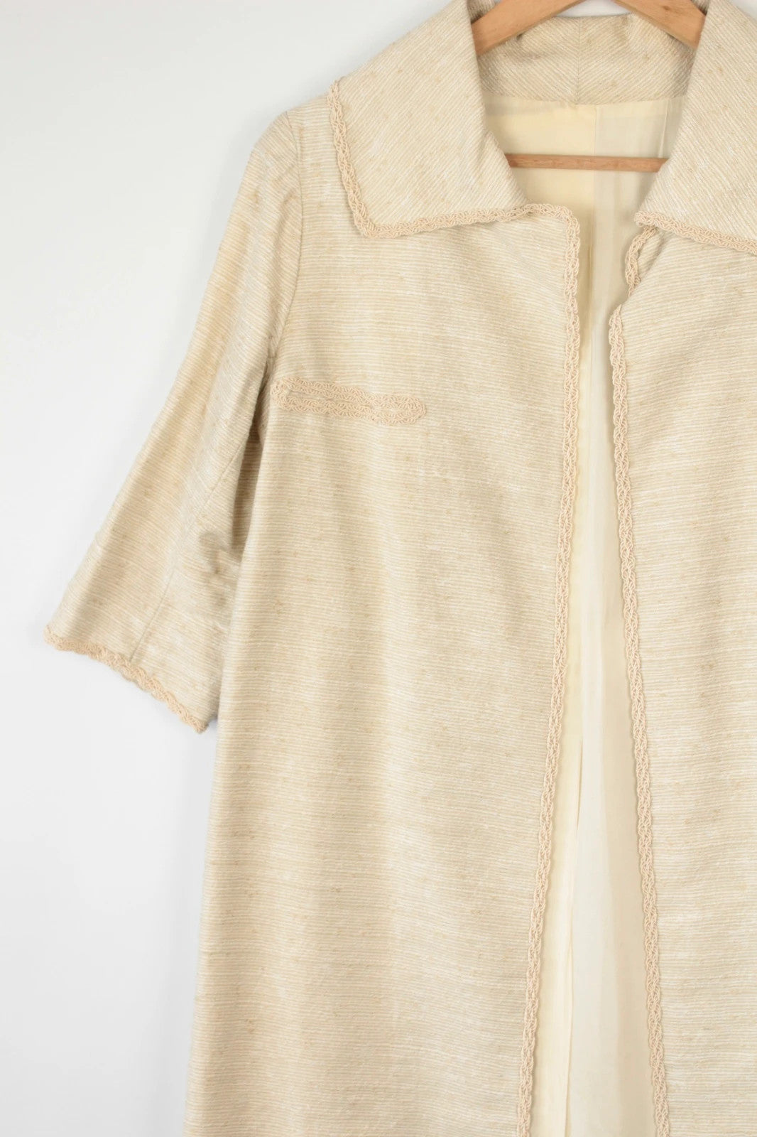 Vintage Dressing beige duster coat open front bouclé tweed textured fabric elegant drape.