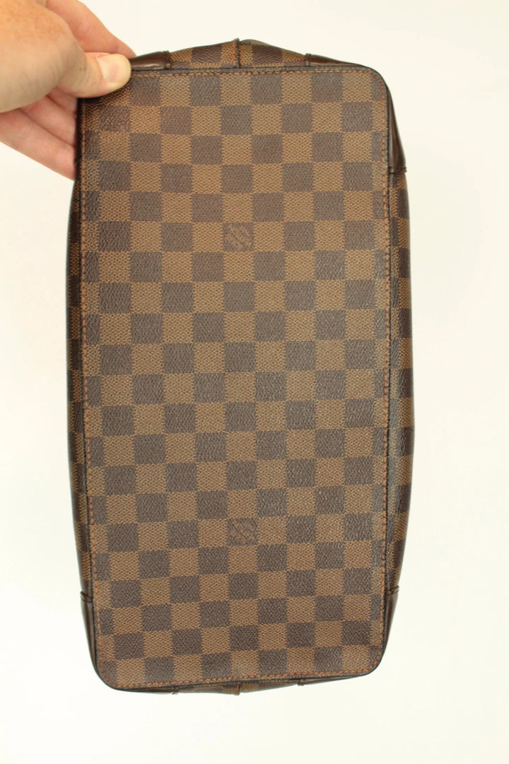 Louis Vuitton brown Hampstead tote bag with Damier Ebene pattern and leather handles.