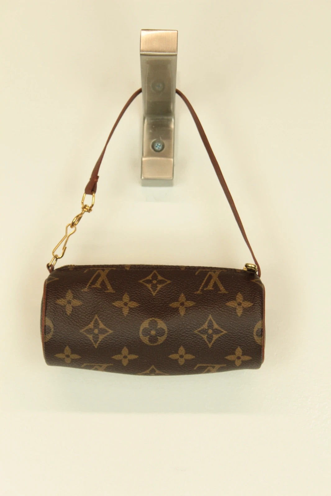 Louis Vuitton brown handbag with monogram pattern, coated canvas, and gold-tone hardware.