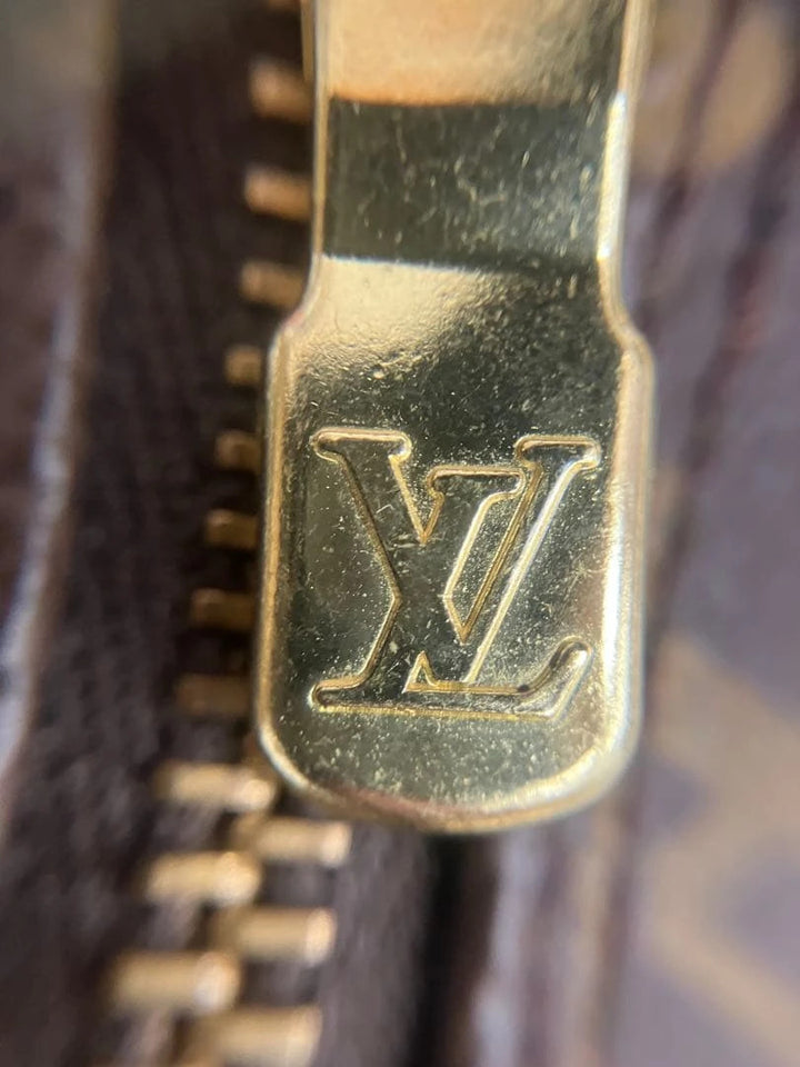 Louis Vuitton brown handbag with monogram pattern, coated canvas, and gold-tone hardware.