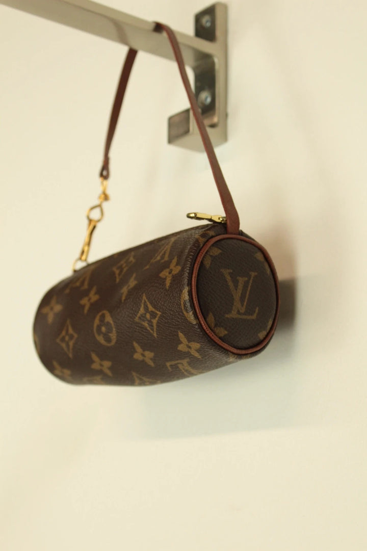 Louis Vuitton brown handbag with monogram pattern, coated canvas, and gold-tone hardware.