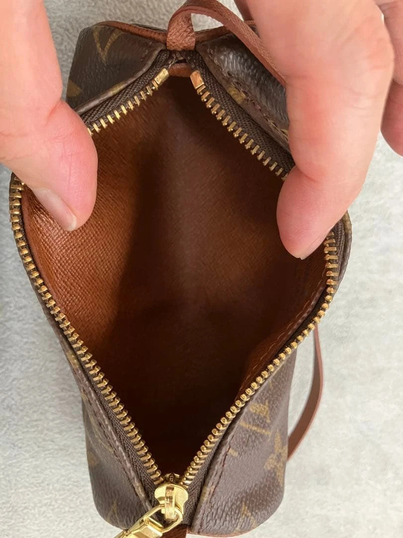 Louis Vuitton brown handbag with monogram pattern, coated canvas, and gold-tone hardware.
