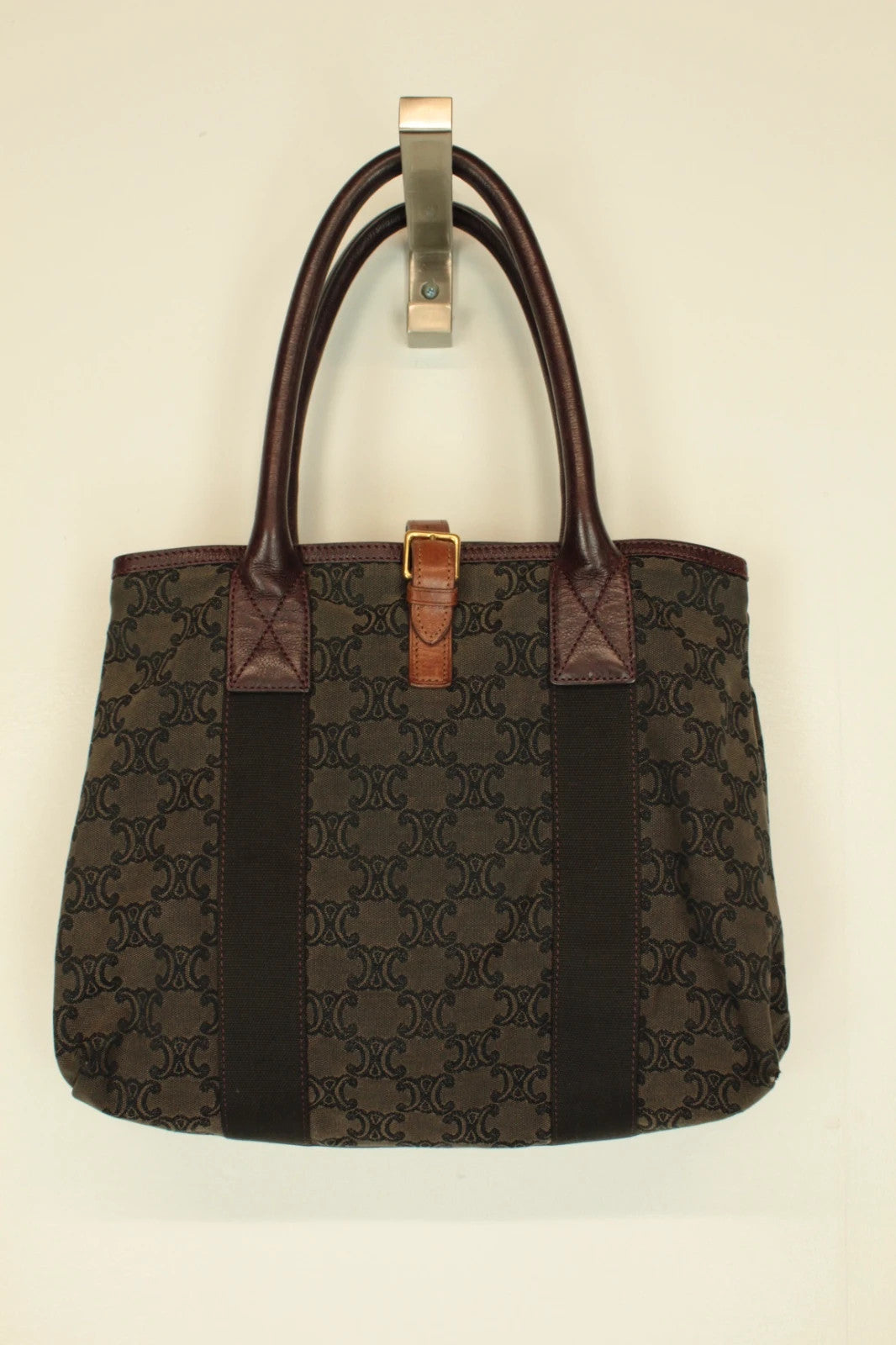 Celine black and brown canvas tote bag with Triomphe monogram and leather trim.