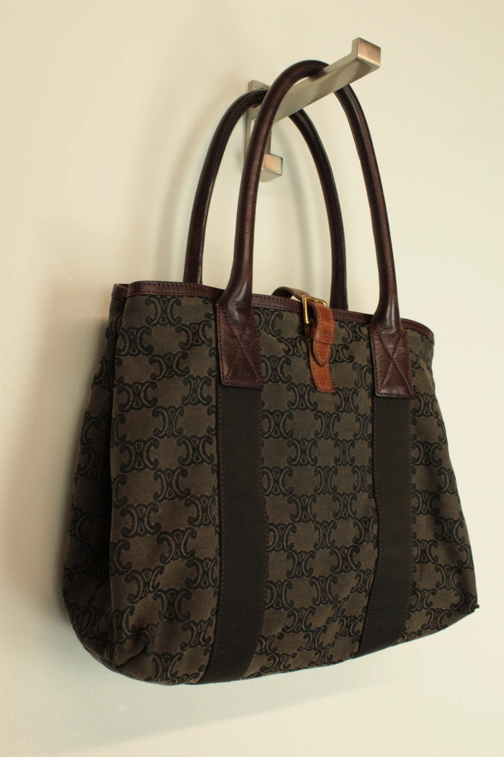 Celine black and brown canvas tote bag with Triomphe monogram and leather trim.
