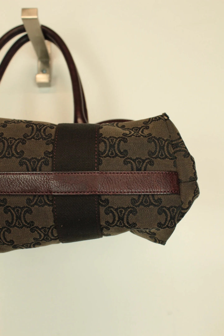Celine black and brown canvas tote bag with Triomphe monogram and leather trim.