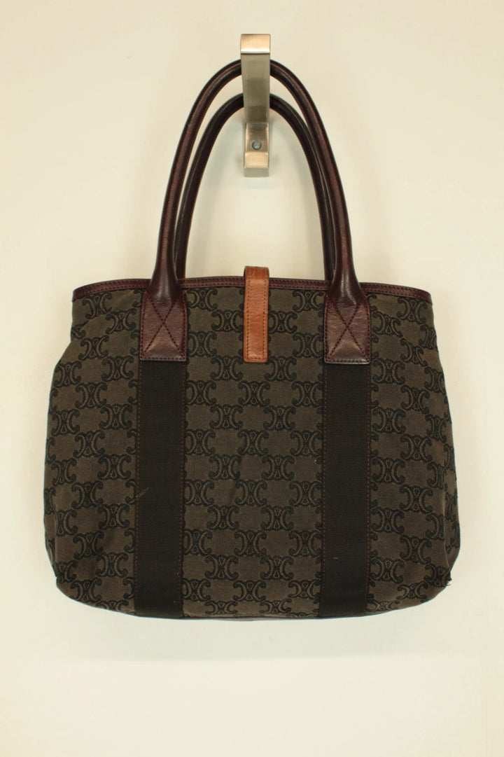 Celine black and brown canvas tote bag with Triomphe monogram and leather trim.