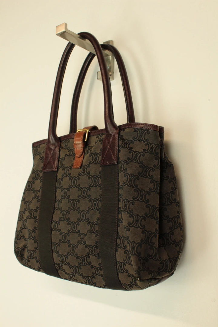 Celine black and brown canvas tote bag with Triomphe monogram and leather trim.