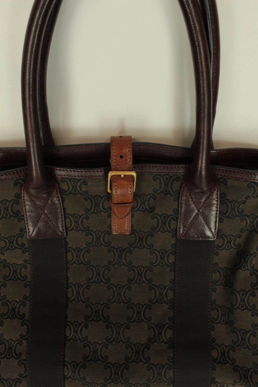 Celine black and brown canvas tote bag with Triomphe monogram and leather trim.
