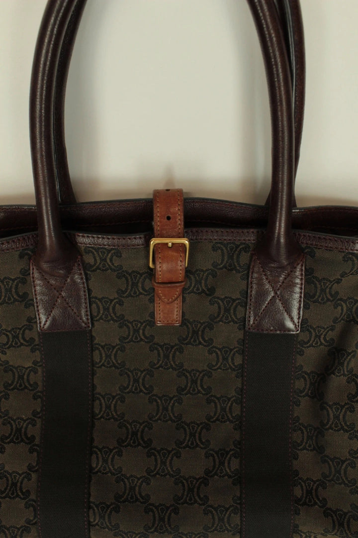 Celine black and brown canvas tote bag with Triomphe monogram and leather trim.