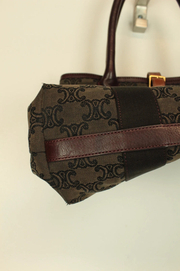 Celine black and brown canvas tote bag with Triomphe monogram and leather trim.