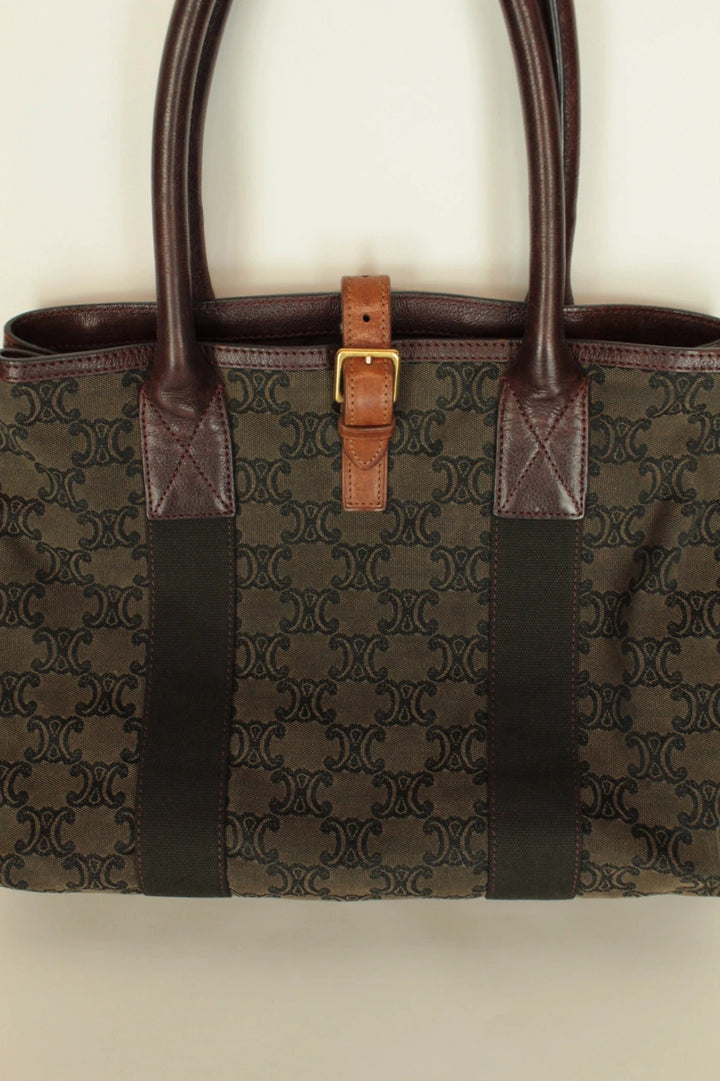 Celine black and brown canvas tote bag with Triomphe monogram and leather trim.