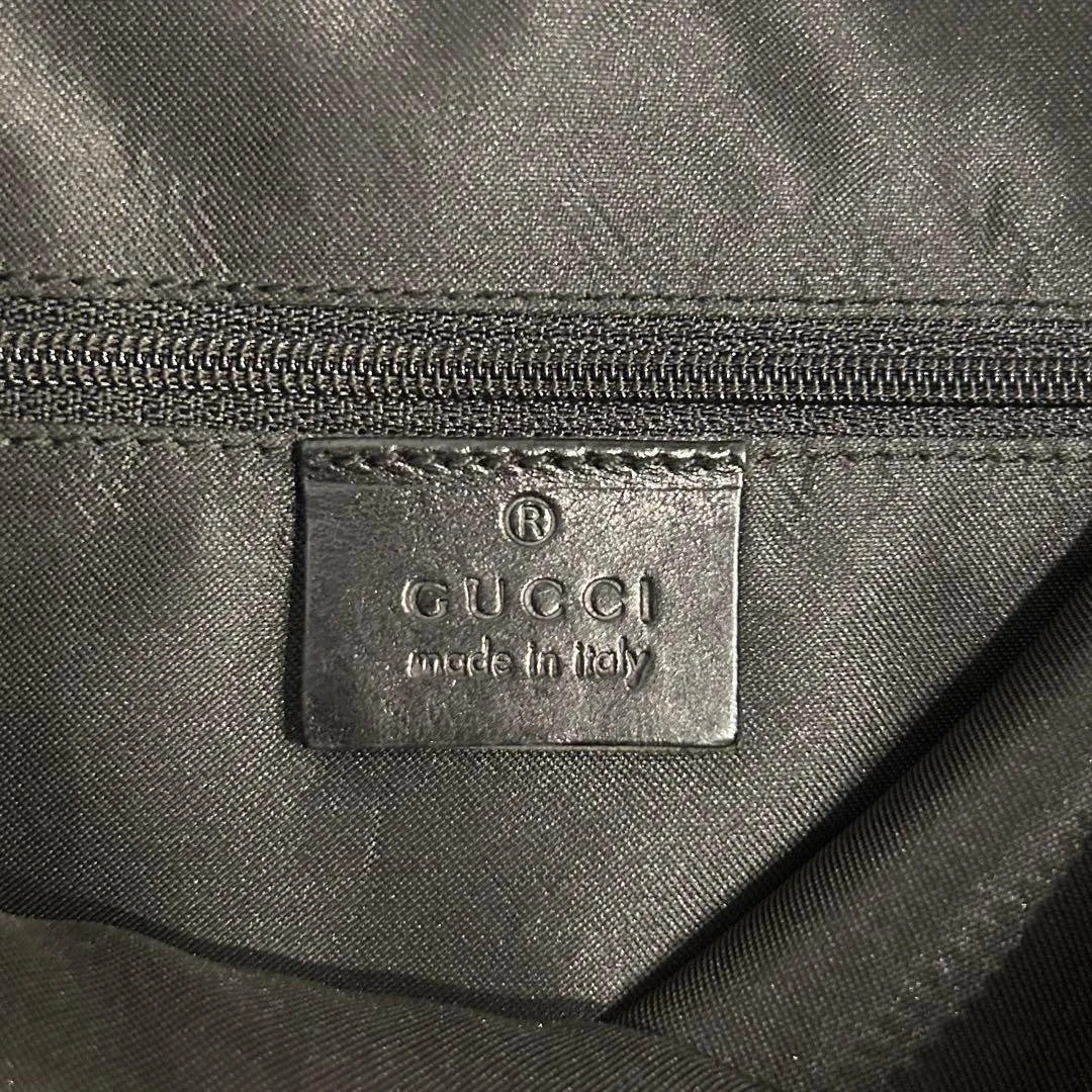 Gucci black hobo shoulder bag with GG monogram pattern and leather trim.