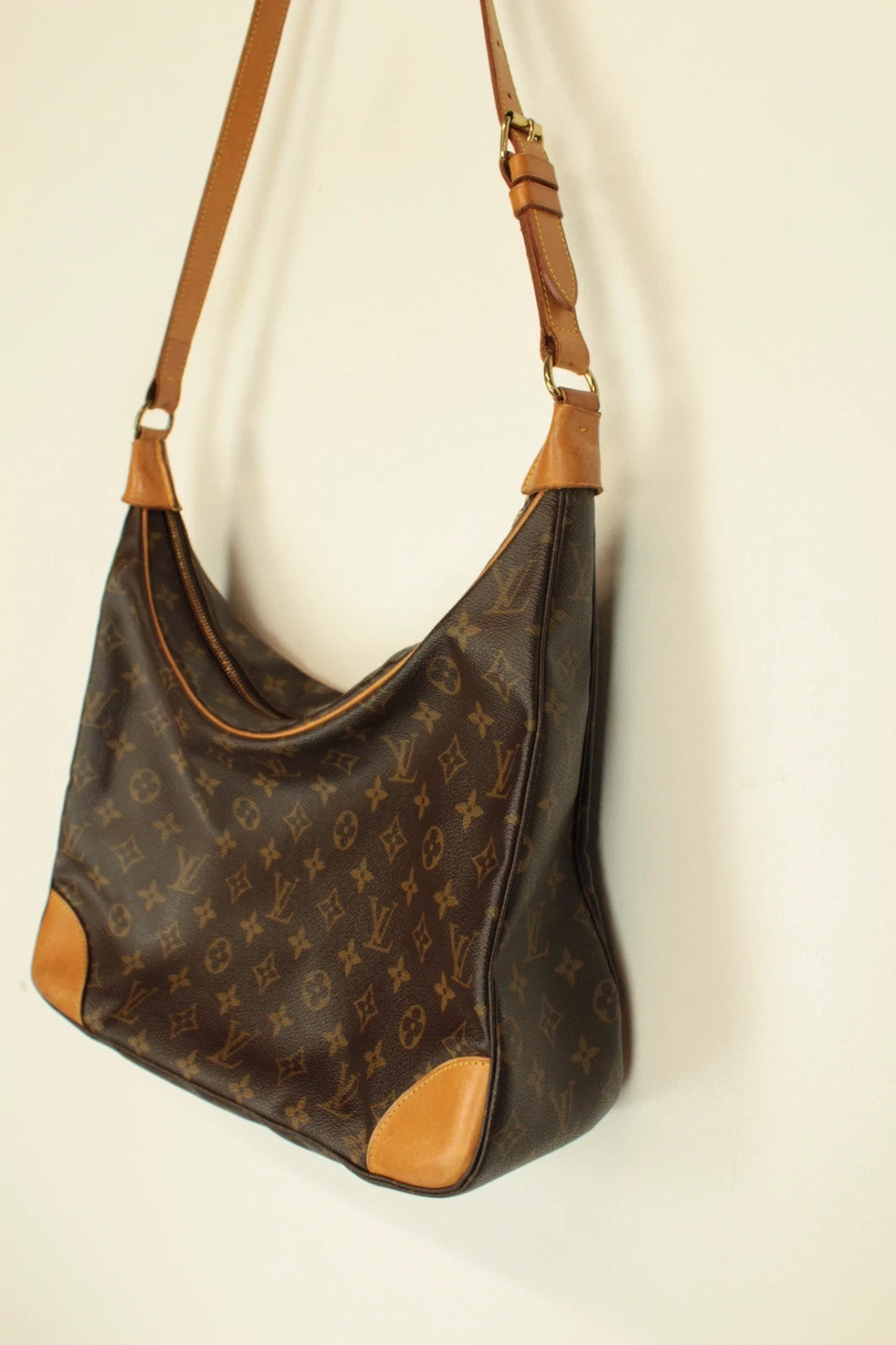 Louis Vuitton hobo bag black brown monogram canvas with vachetta leather trim and gold hardware.