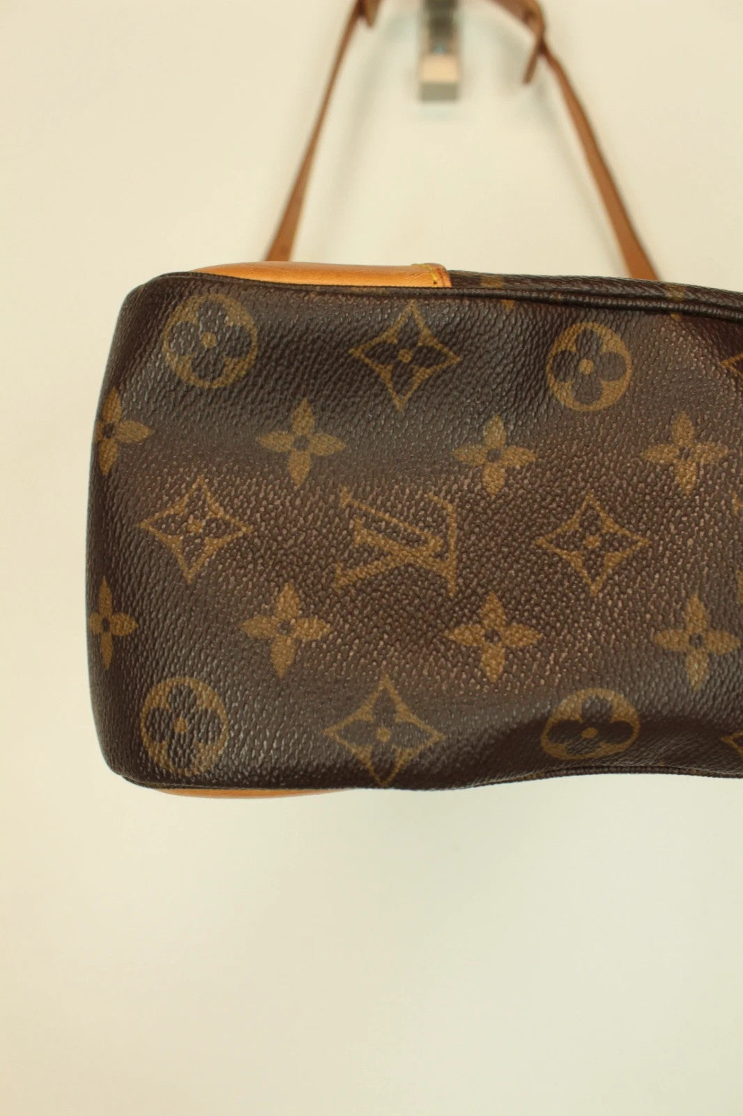 Louis Vuitton hobo bag black brown monogram canvas with vachetta leather trim and gold hardware.