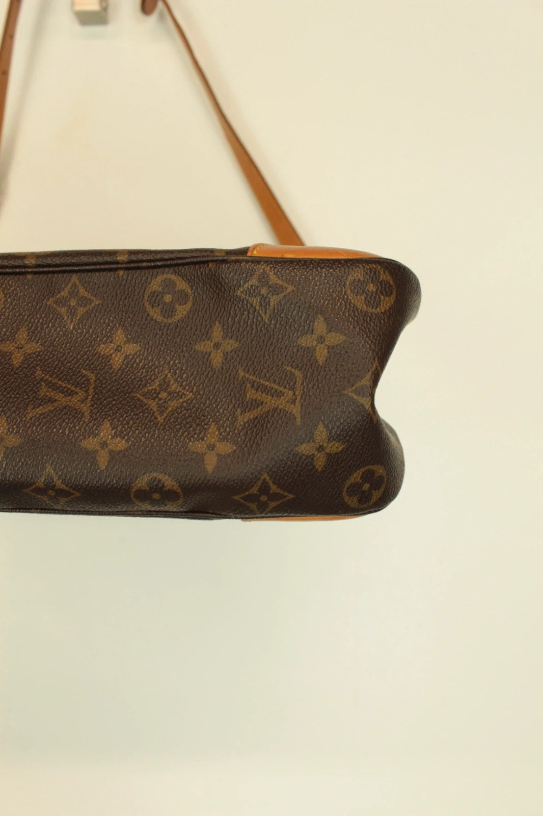 Louis Vuitton hobo bag black brown monogram canvas with vachetta leather trim and gold hardware.