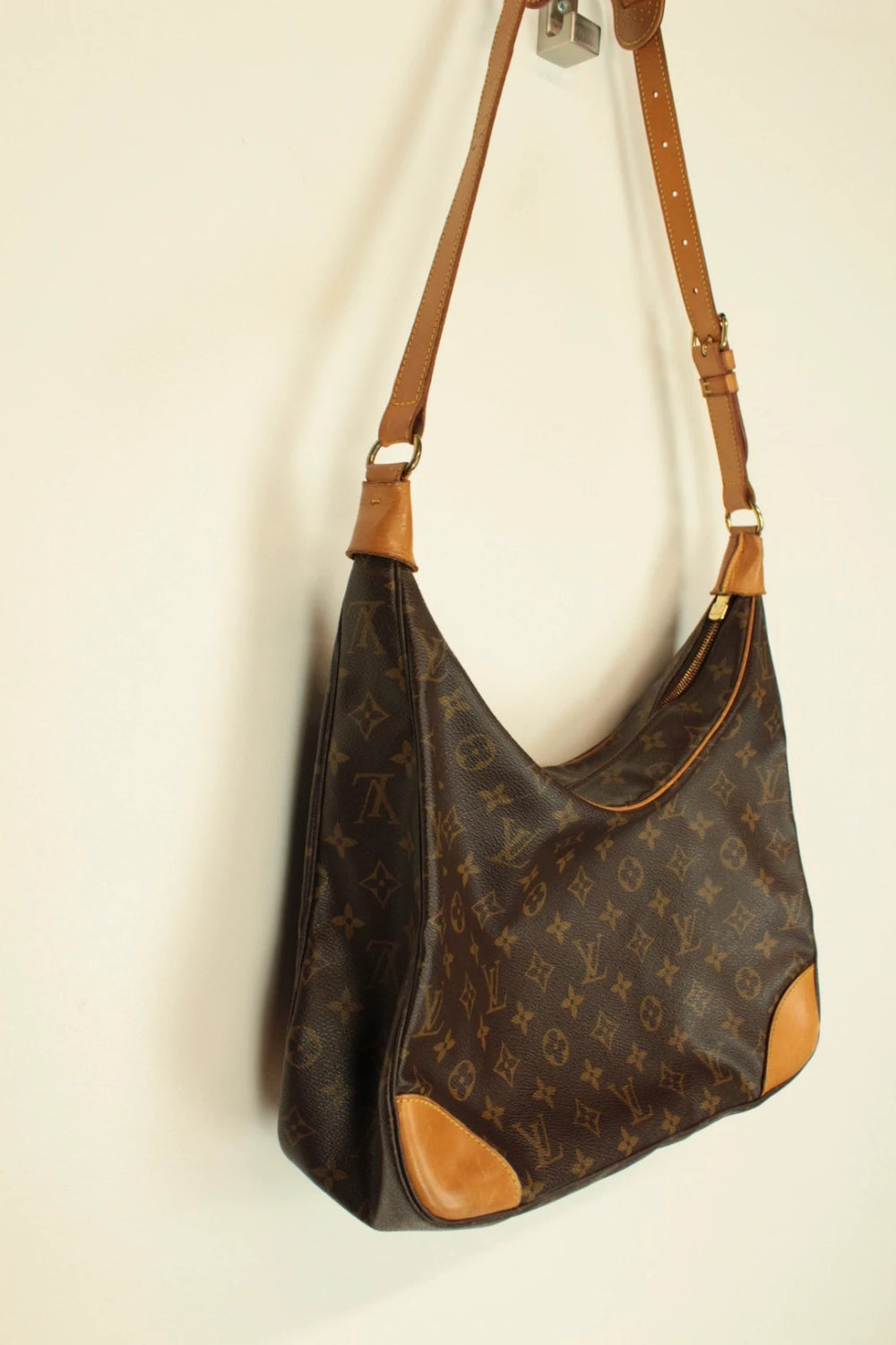 Louis Vuitton hobo bag black brown monogram canvas with vachetta leather trim and gold hardware.
