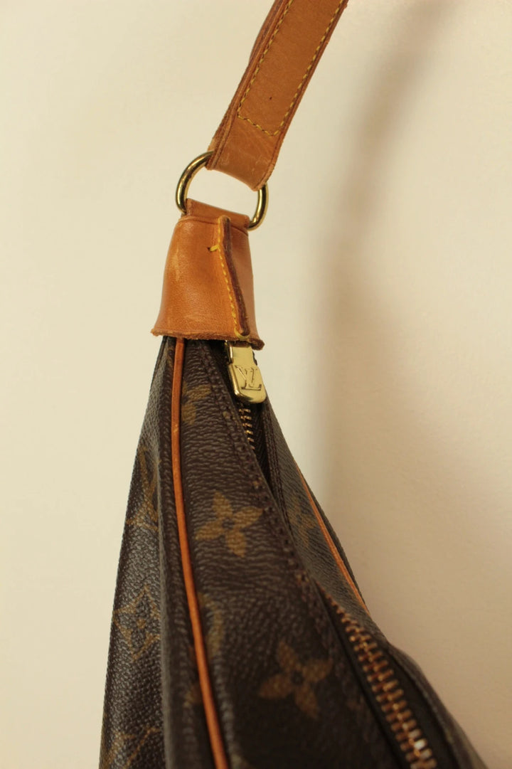 Louis Vuitton hobo bag black brown monogram canvas with vachetta leather trim and gold hardware.