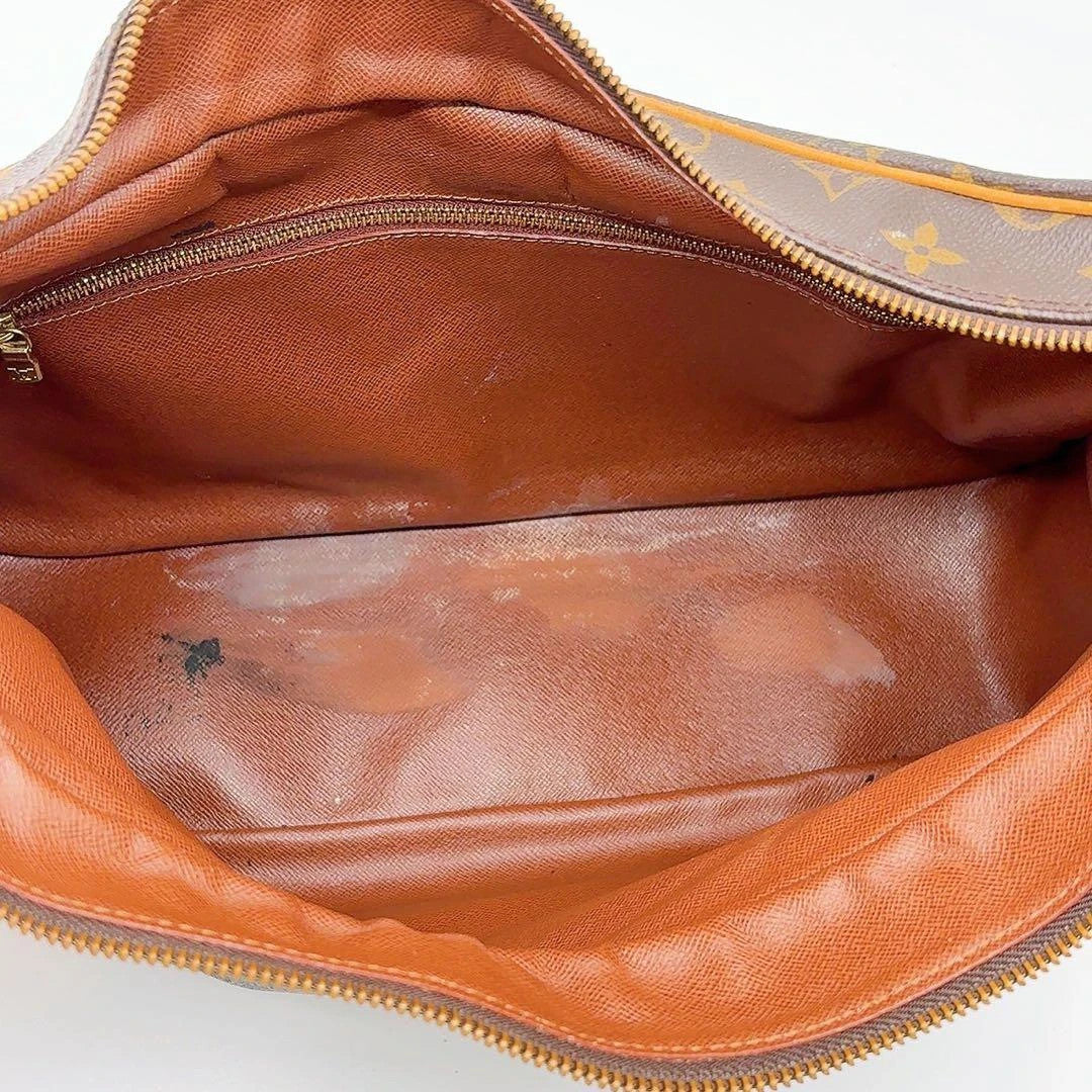 Louis Vuitton hobo bag black brown monogram canvas with vachetta leather trim and gold hardware.