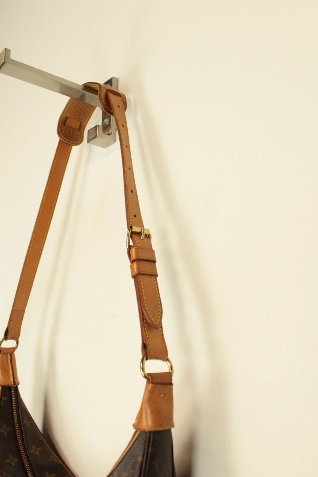 Louis Vuitton hobo bag black brown monogram canvas with vachetta leather trim and gold hardware.