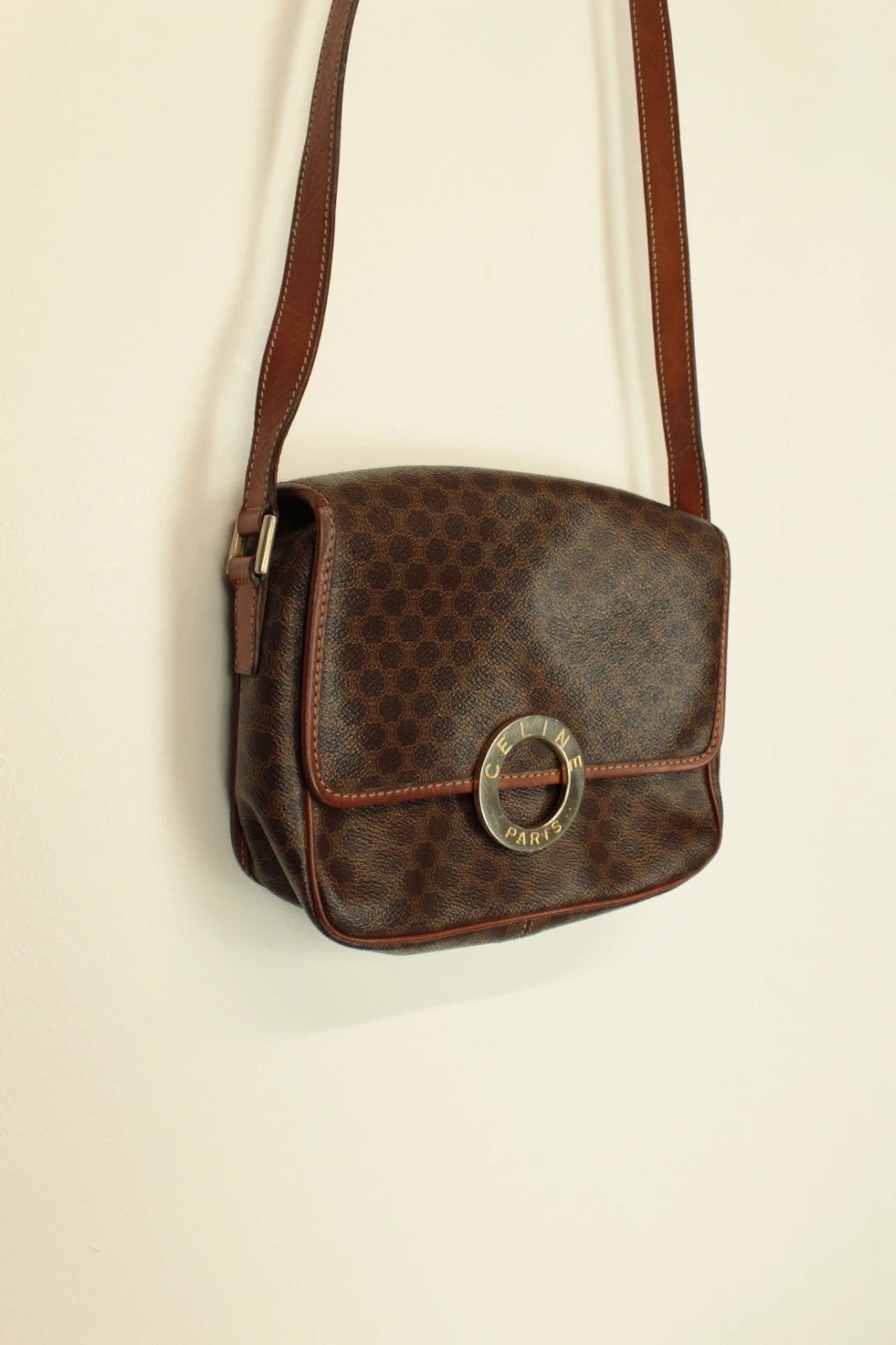 Celine beige and brown vintage leather crossbody bag with silver circle logo and smooth trim.