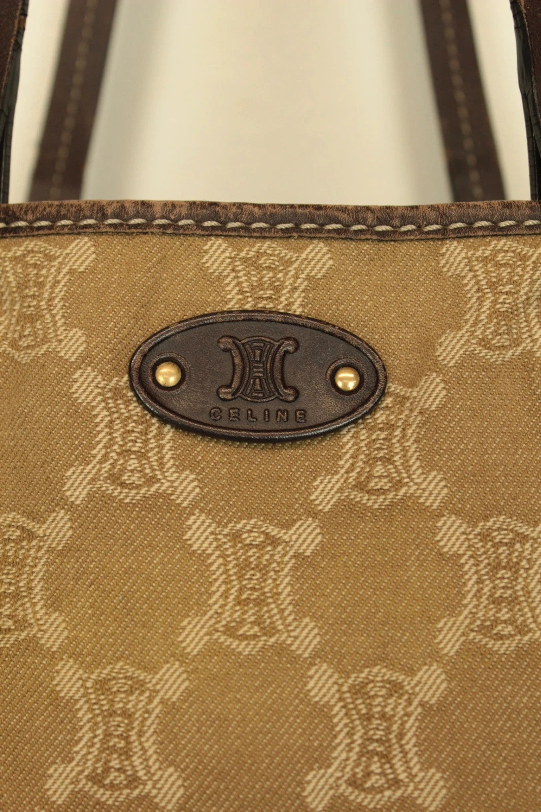 Celine beige and brown tote bag with Triomphe monogram canvas and leather trim.