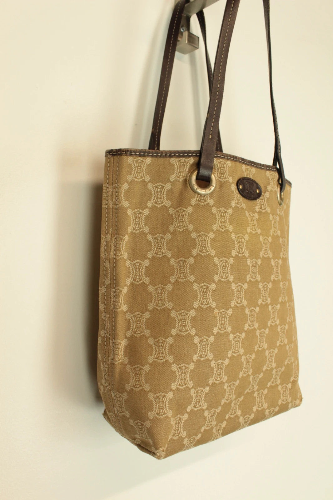 Celine beige and brown tote bag with Triomphe monogram canvas and leather trim.
