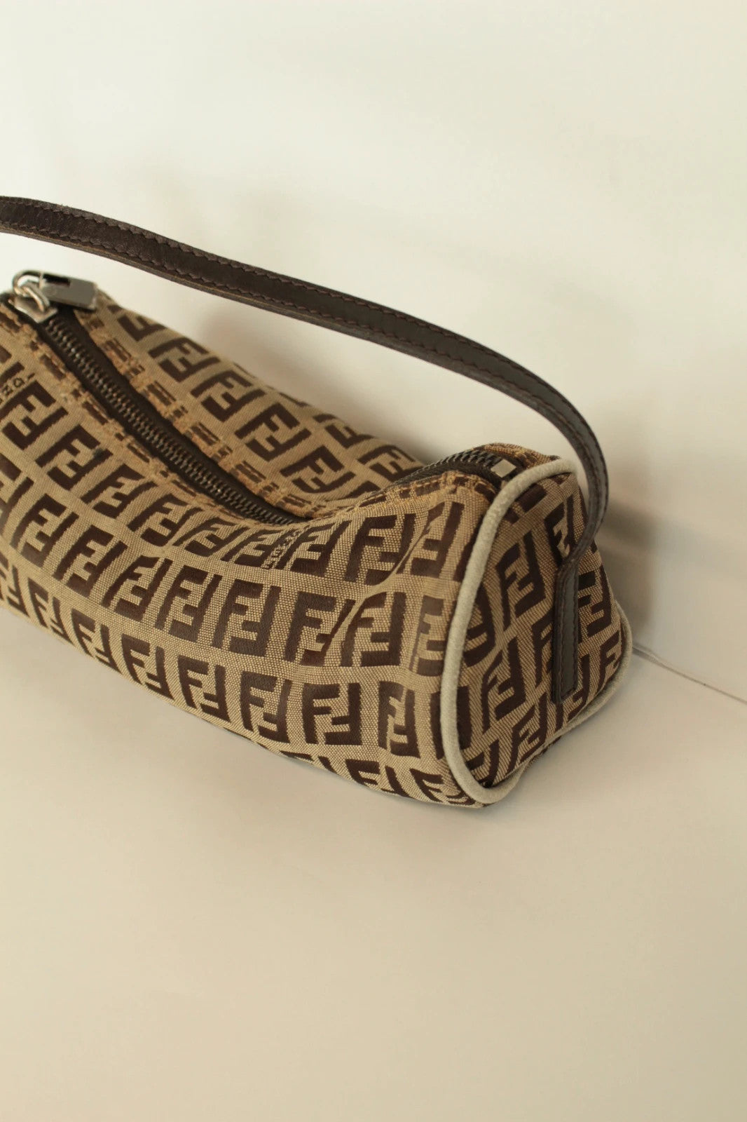 Fendi beige and brown mini cylinder barrel bag with FF monogram jacquard canvas and leather trim.