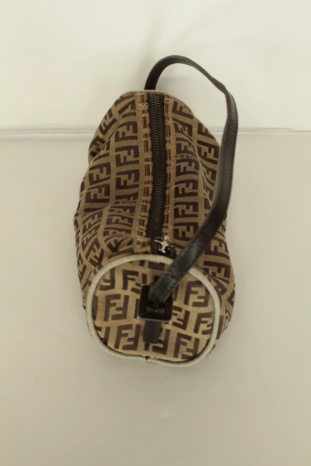 Fendi beige and brown mini cylinder barrel bag with FF monogram jacquard canvas and leather trim.
