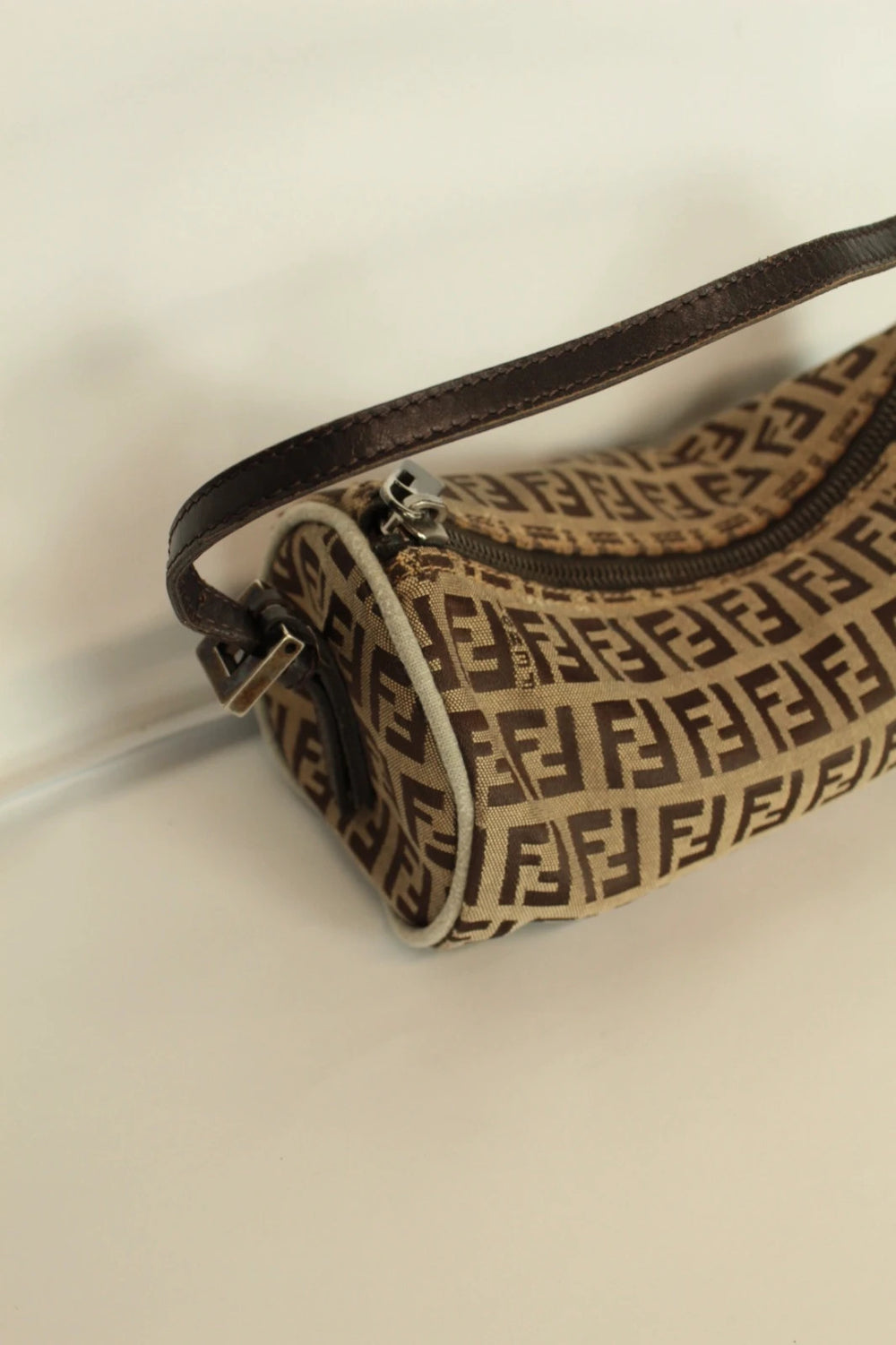 Fendi beige and brown mini cylinder barrel bag with FF monogram jacquard canvas and leather trim.